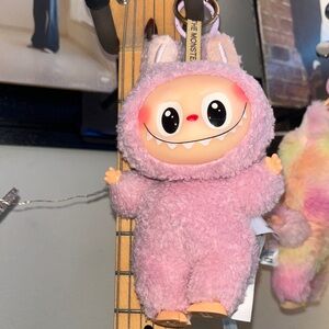 Pink “labubu” plush toy